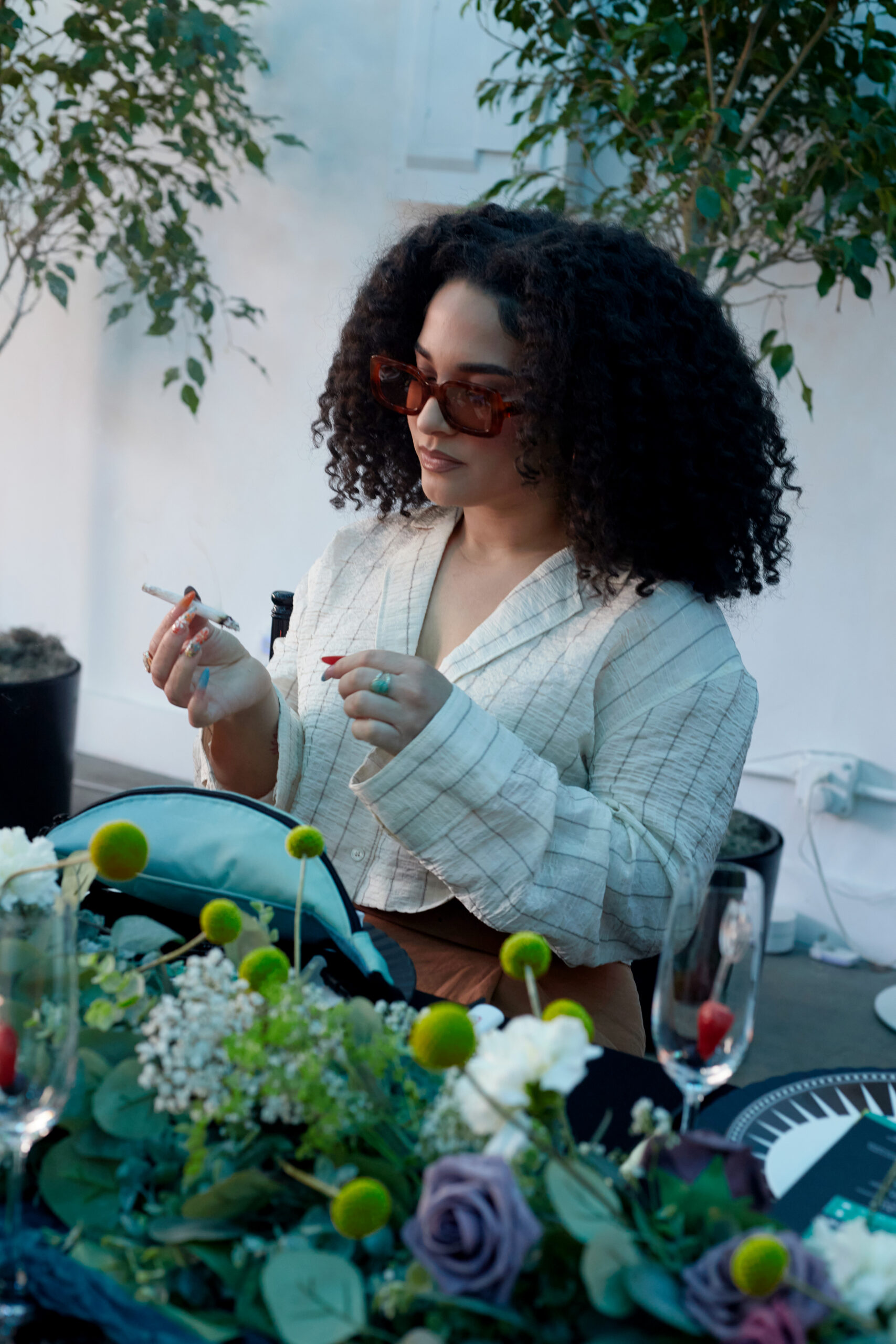 Stylish event guest posing for photos